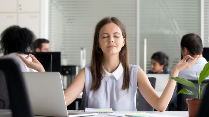 female-employee-meditate-managing-stress