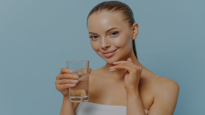woman-holding-glass-of-clean-water