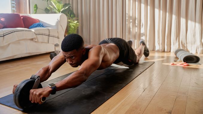 african man doing fitness - Ab Wheel Benefits