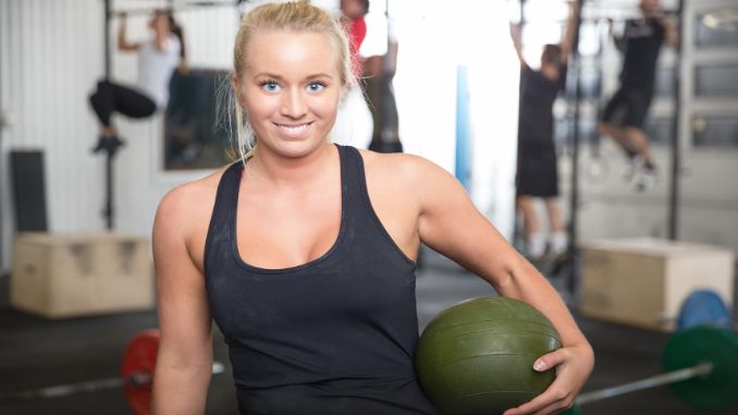 smiling-blonde-woman-with-slam-ball - Slam Ball Exercises